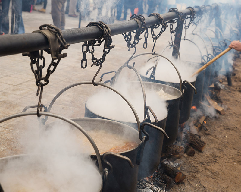 Cooking In Iron Cauldrons On Open Fire