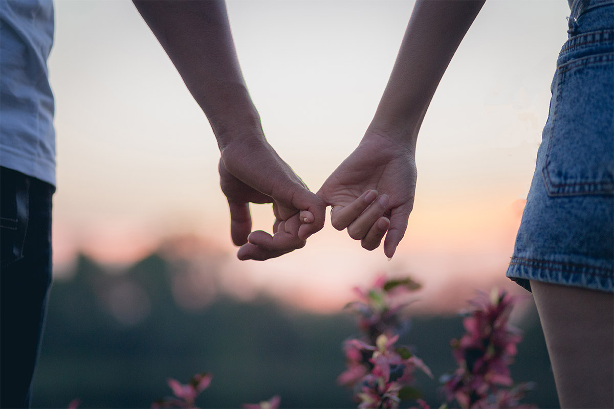 Teenagers holding hands